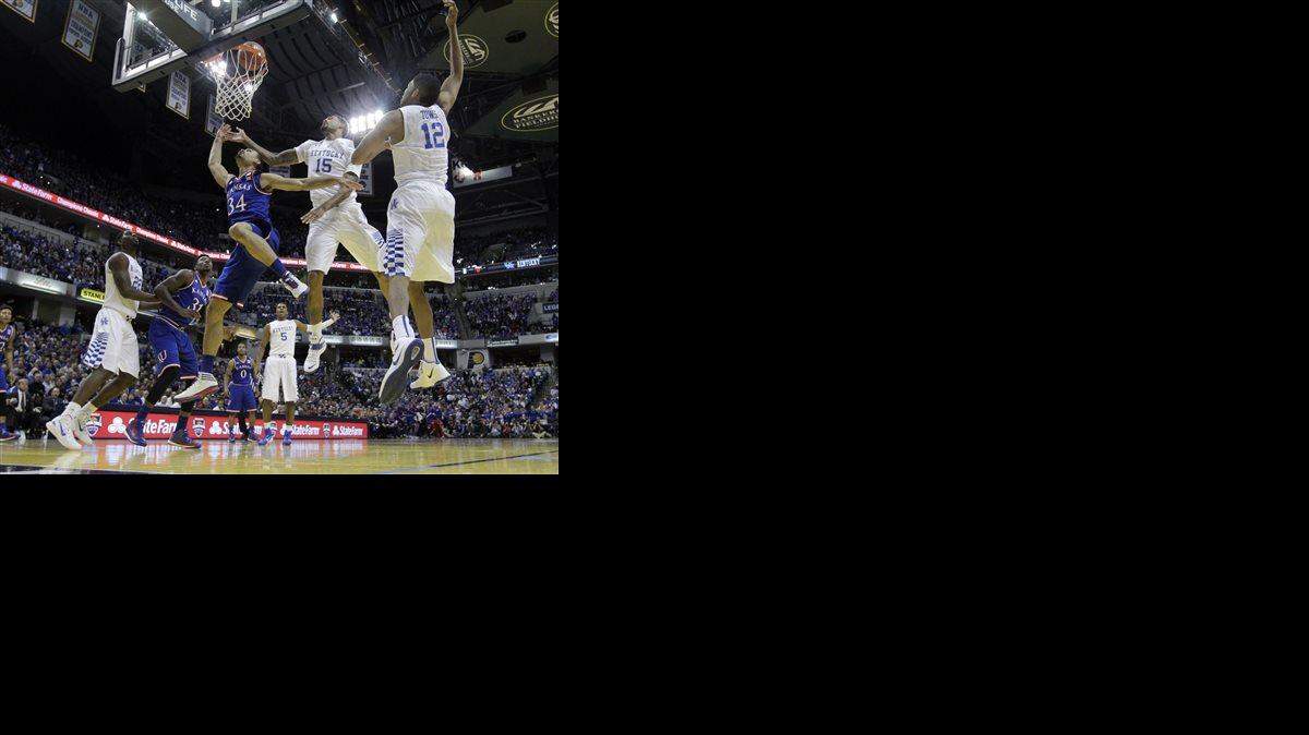 
Kansas's Perry Ellis (34) puts up a shot during the first half of an NCAA college basketball game against the Kentucky, Tuesday, Nov. 18, 2014, in Indianapolis. (AP Photo/Darron Cummings)
