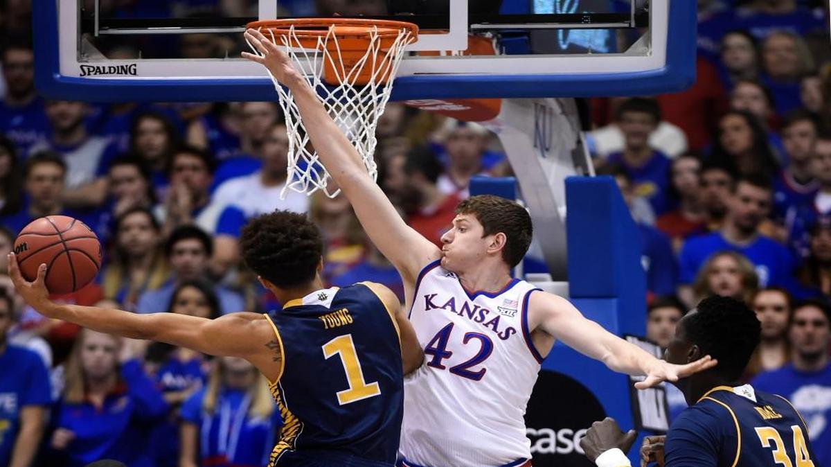 KU’s Hunter Mickelson tries to stop UC Irvine’s Alex Young during the first half Tuesday in Lawrence.