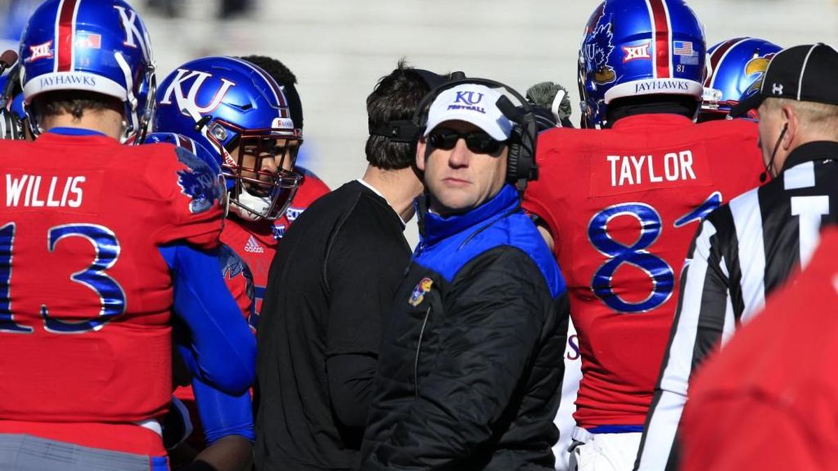 Kansas coach David Beaty said Monday he won’t name a starting quarterback until one takes the field against Rhode Island on Saturday night.