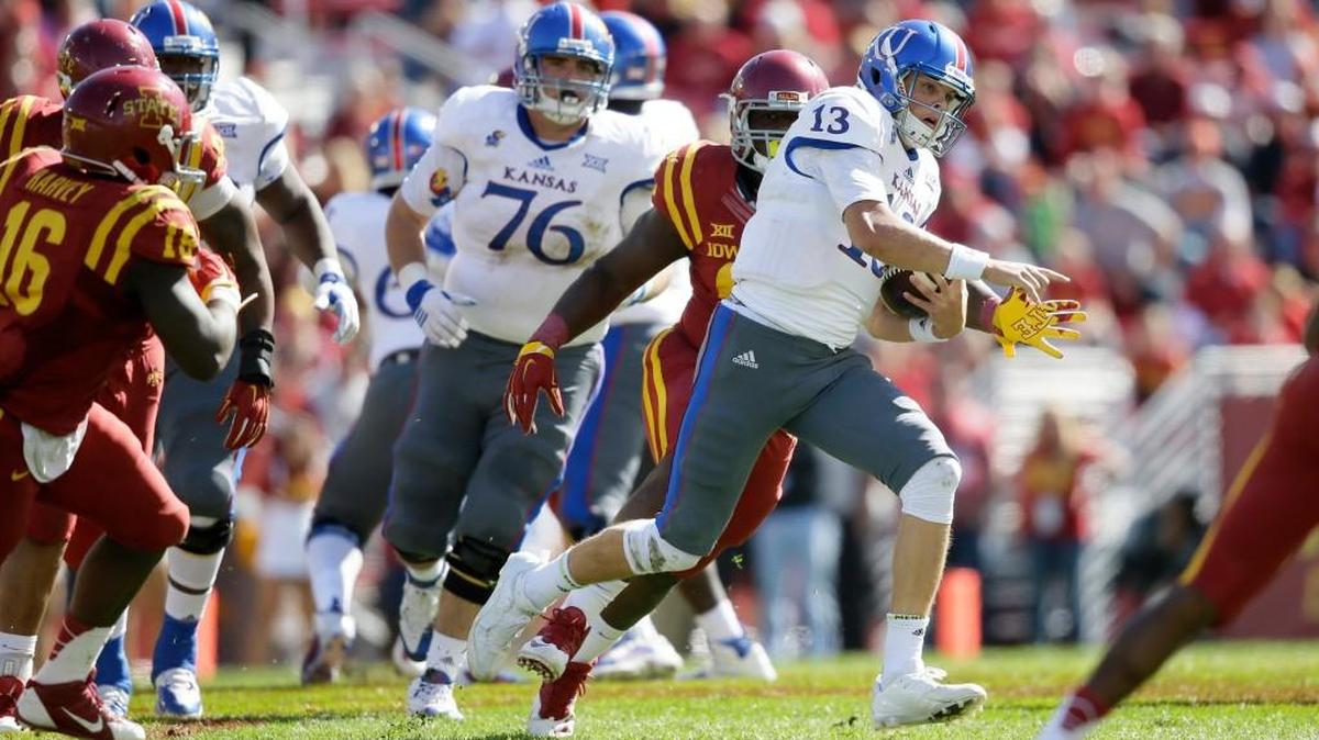 Kansas quarterback Ryan Willis (13) carries the ball during the second half against Iowa State last October.