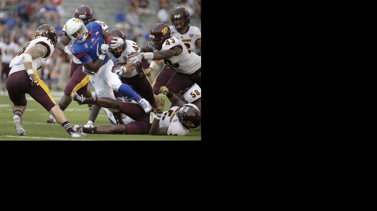 
Kansas running back Corey Avery (6) gets through a group of Central Michigan defenders on Sept. 20.

