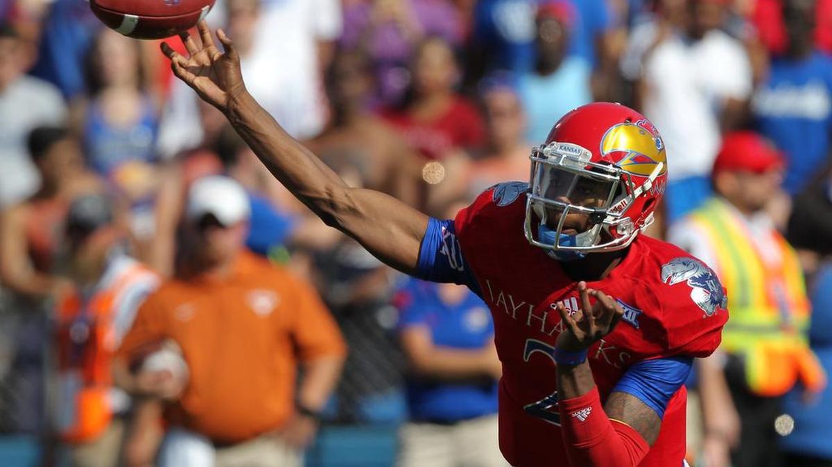 
Kansas quarterback Montell Cozart is an in-state prospect who stayed close to home to play football. New coach David Beaty sent his coaches far and wide in the state to renew relationships with high school coaches.
