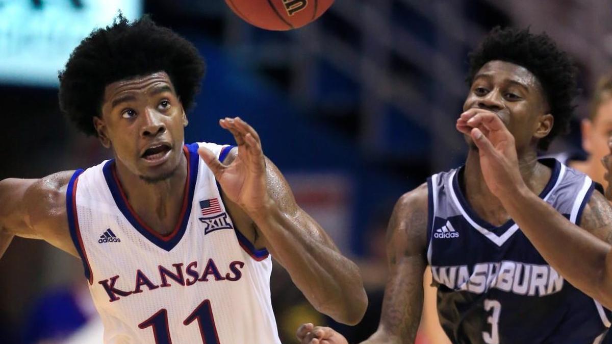 Kansas guard Josh Jackson (11) chases the ball against Washburn guard Randall Smith (3) on Tuesday at Allen Fieldhouse.