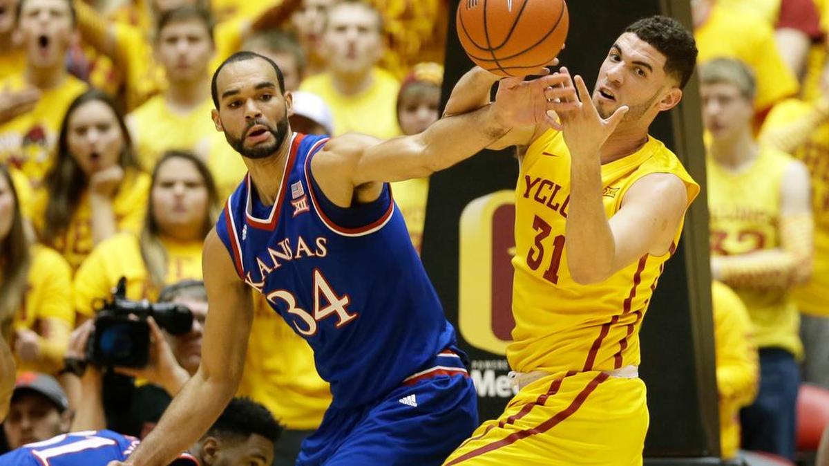 Kansas’ Perry Ellis, left, fights for a loose ball with Georges Niang on Monday. Ellis has 23 points to lead the Jayhawks but Iowa State won the game 85-72.