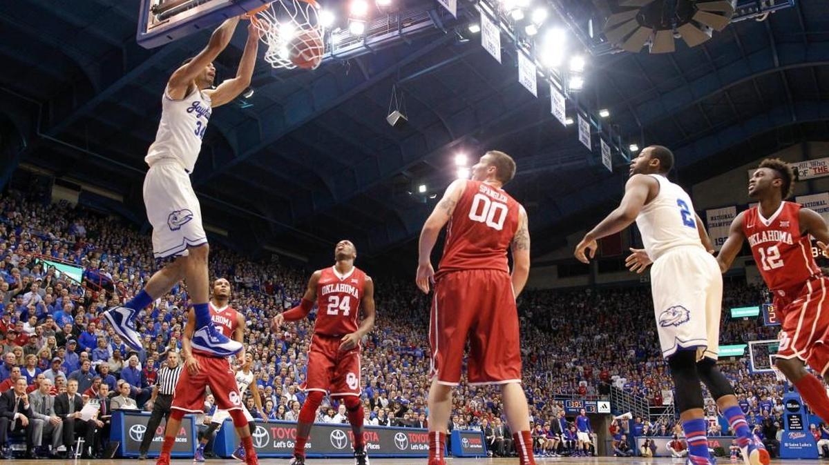 
Kansas forward Perry Ellis dunks the ball over Oklahoma forward Ryan Spangler.
