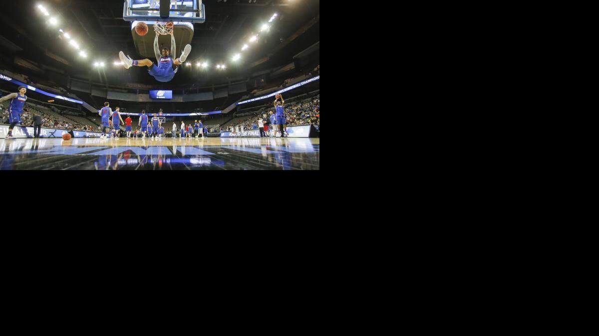 
Kansas’ Landon Lucas dunks the ball during the Jayhawks' open practice at the CenturyLink Center in Omaha on Thursday.
