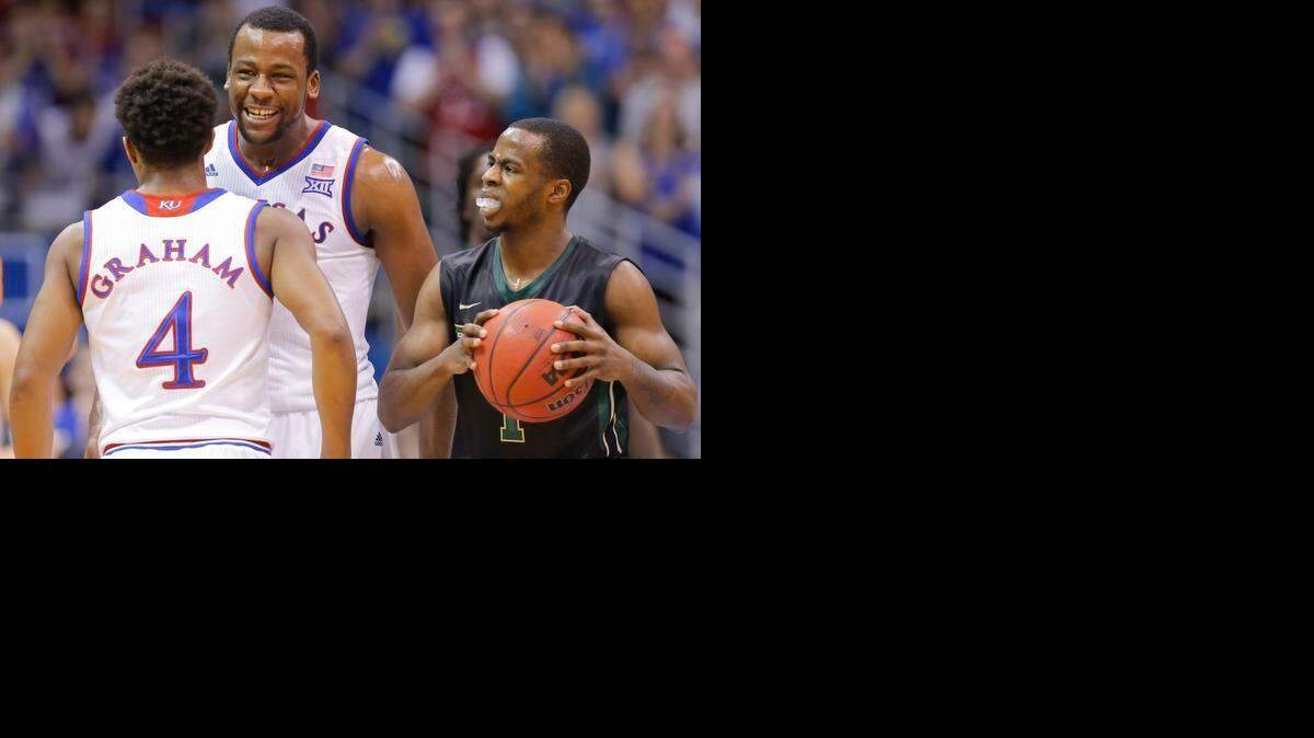 
Kansas’ Cliff Alexander (facing) celebrates a Jayhawk run against Baylor with Devonte’ Graham.
