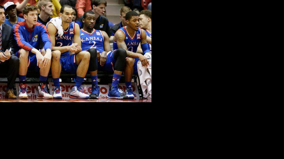 
Kansas forward Perry Ellis (second from left) sat on the bench in the first half of the Jayhawks’ 86-81 loss to Iowa State on Saturday in Hilton Coliseum in Ames, Iowa.
