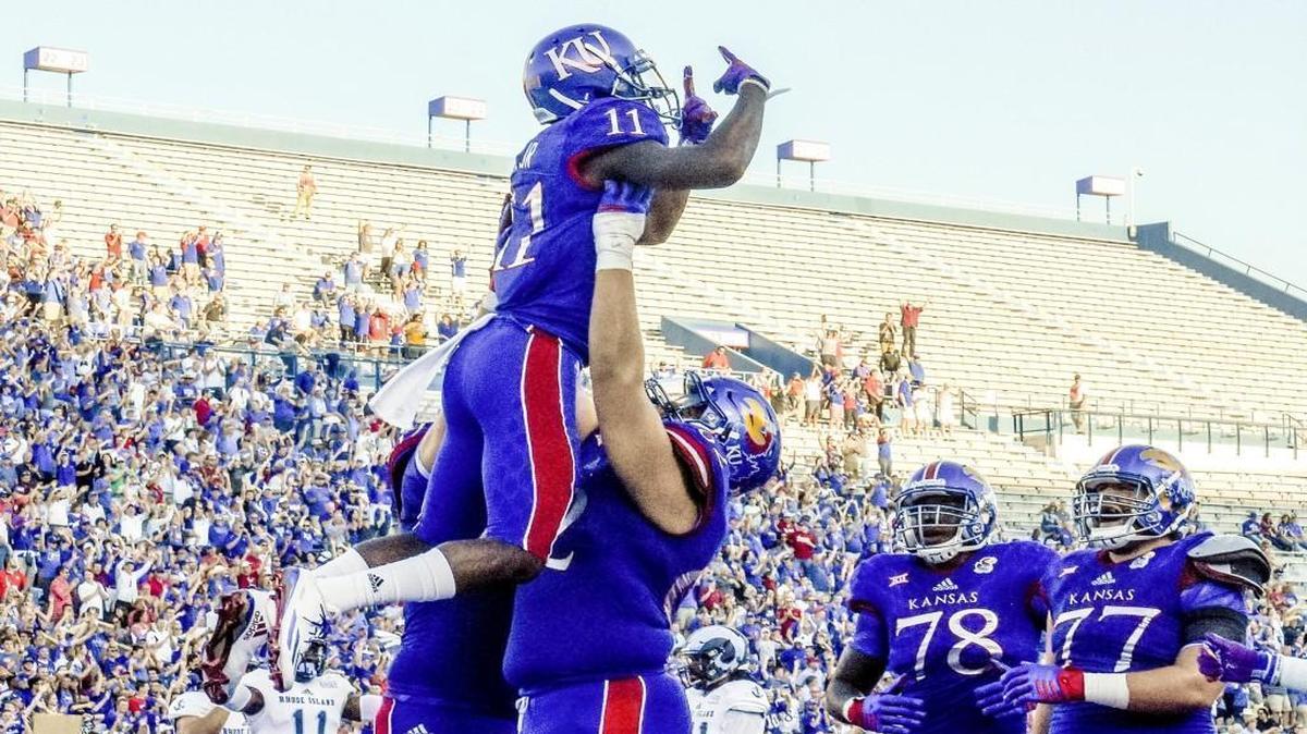 Kansas wide receiver Steven Sims Jr. is lifted up by teammates in the end zone during the first half Saturday.