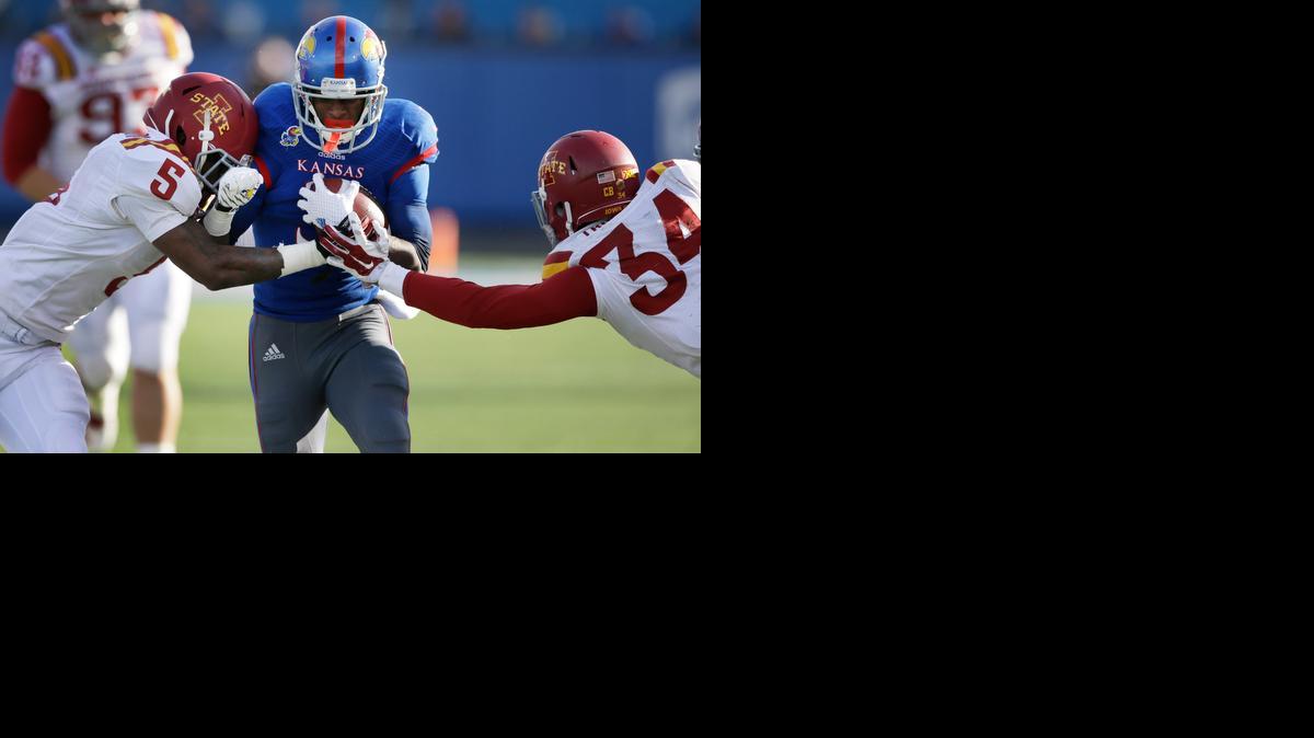 
Kansas wide receiver Tony Pierson splits Iowa State defenders Kamari Cotton-Moya, left, and Nigel Tribune during the first half Saturday in Lawrence.
