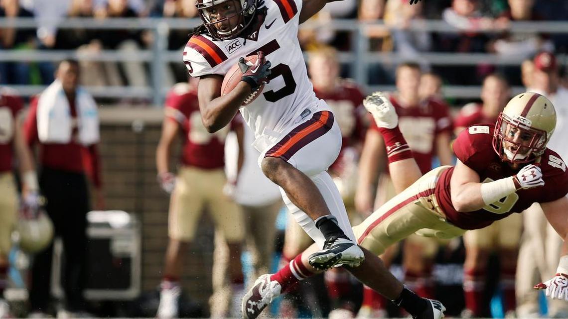 
Virginia Tech’s Joshua Stanford runs against Boston College during the first half of their game Nov. 2, 2013, in Boston.
