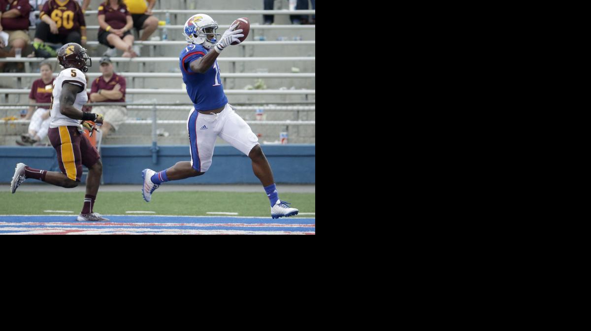 
Kansas wide receiver Justin McCay, right, is chased into the end zone on a touchdown by Central Michigan defensive back Kavon Frazier on Saturday in Lawrence, Kan. 
