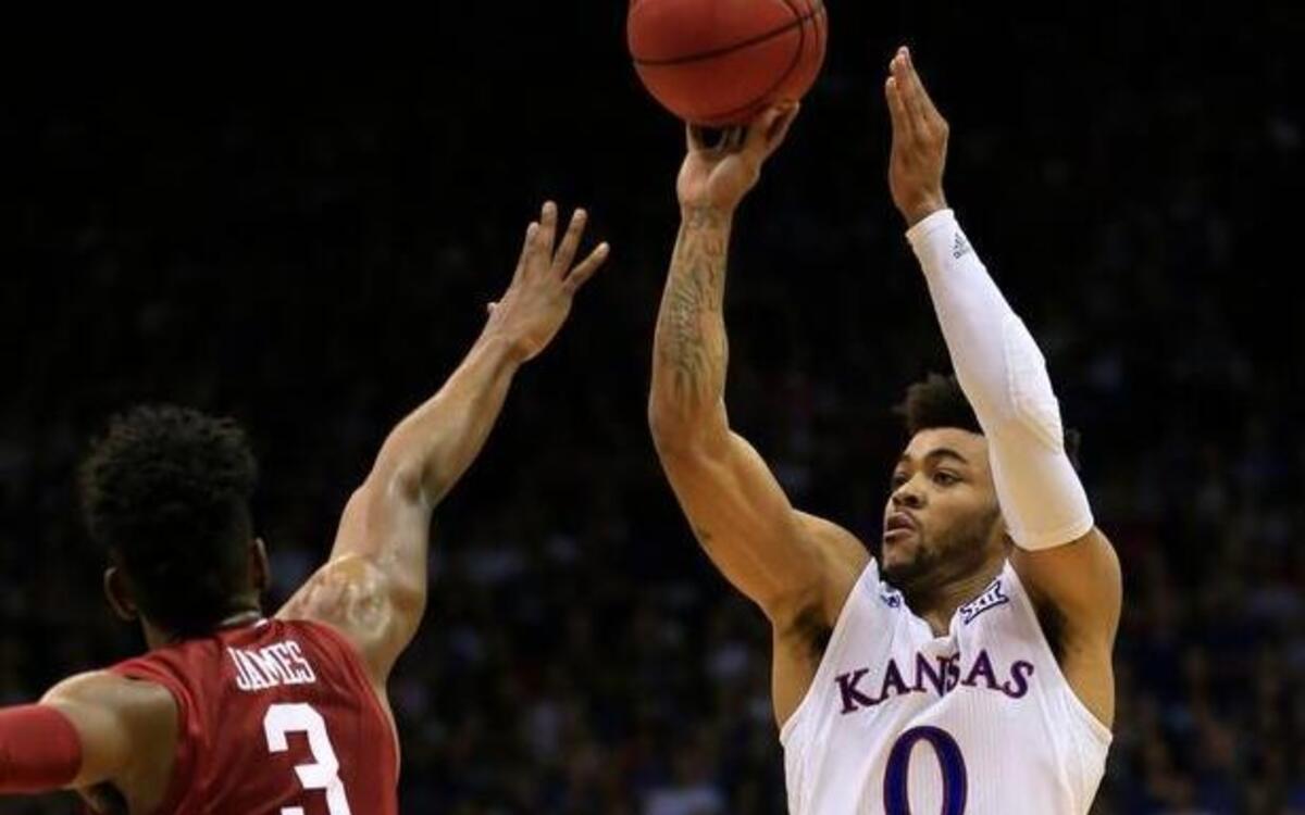 Kansas guard Frank Mason shoots over Oklahoma guard Christian James during Monday night’s first half in Lawrence.