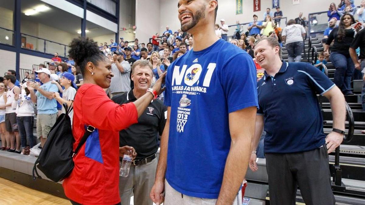 Perry Ellis enjoys himself as he gets a pat on the back from local legend Lynette Woodard, left, in May.