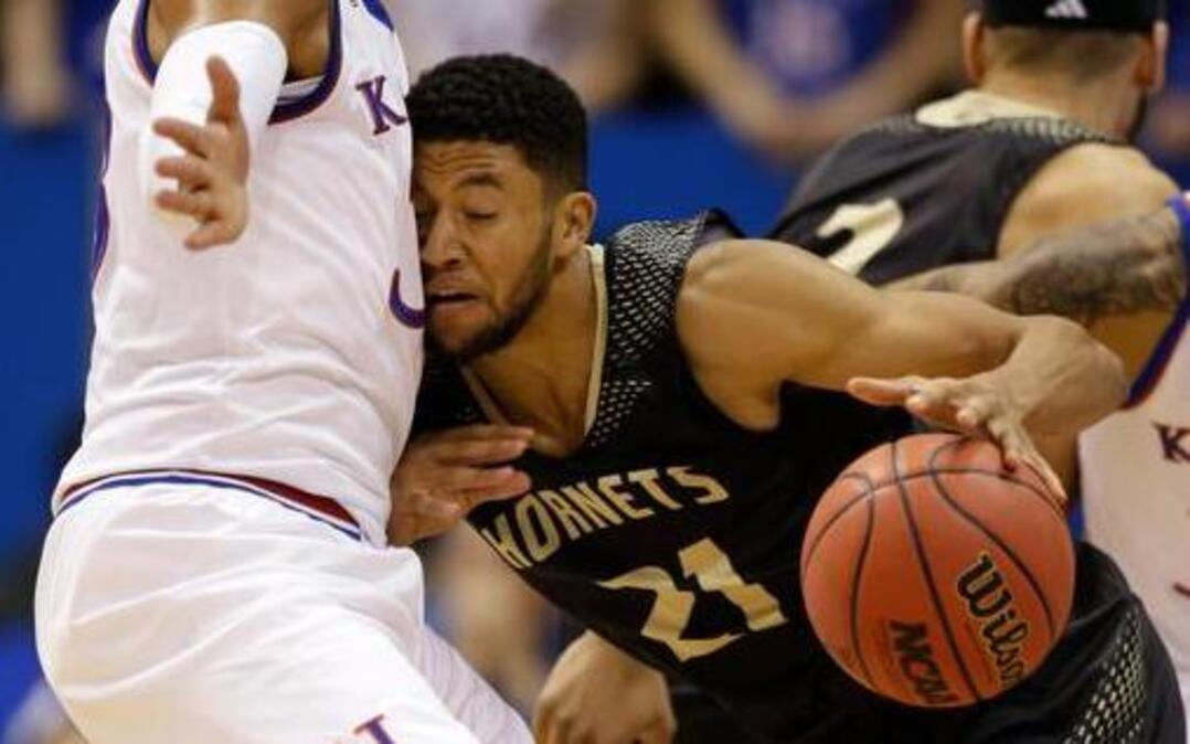 
Emporia State guard Jevon Taylor, right, runs into Kansas forward Landen Lucas during the first half of an exhibition game Tuesday in Lawrence.
