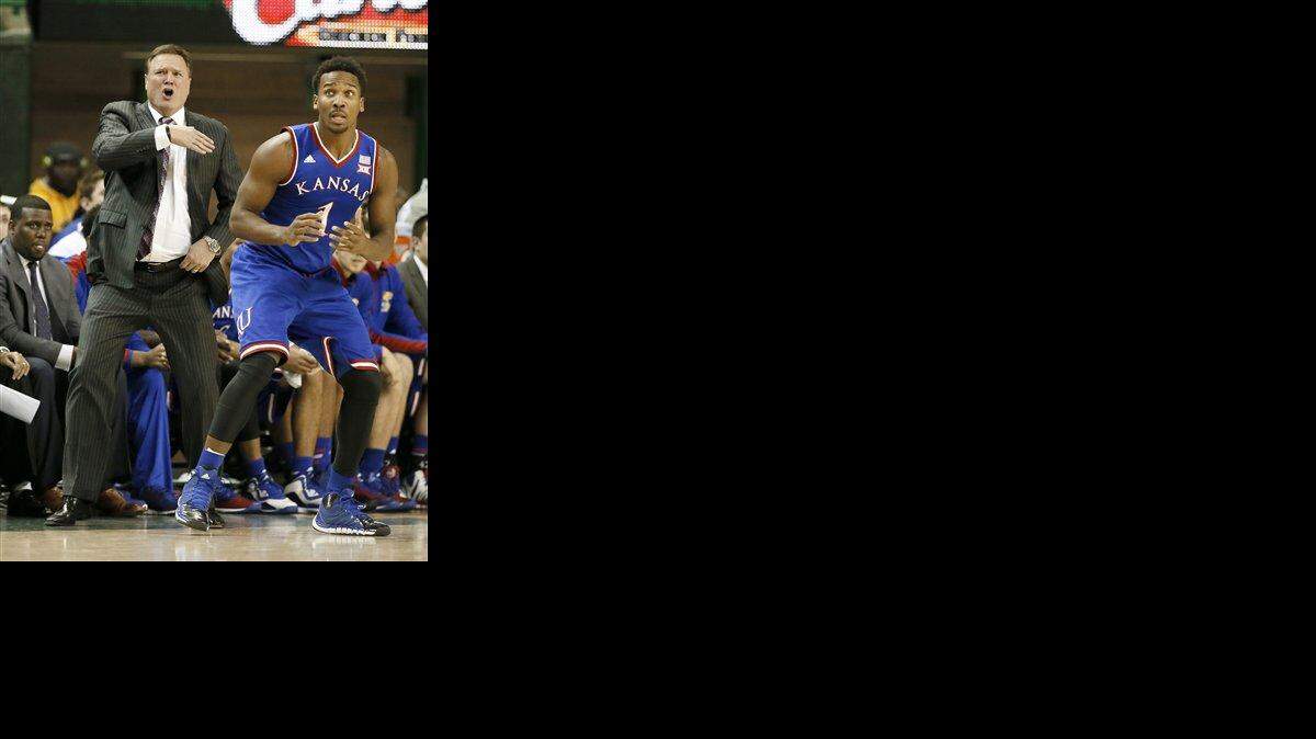 
Kansas head coach Bill Self instructs his team on offense as Wayne Selden Jr. (1) looks for a pass in the second half of an NCAA college basketball game against Baylor, Wednesday, Jan. 7, 2015, in Waco, Texas. Kansas won 56-55. (AP Photo/Tony Gutierrez)
