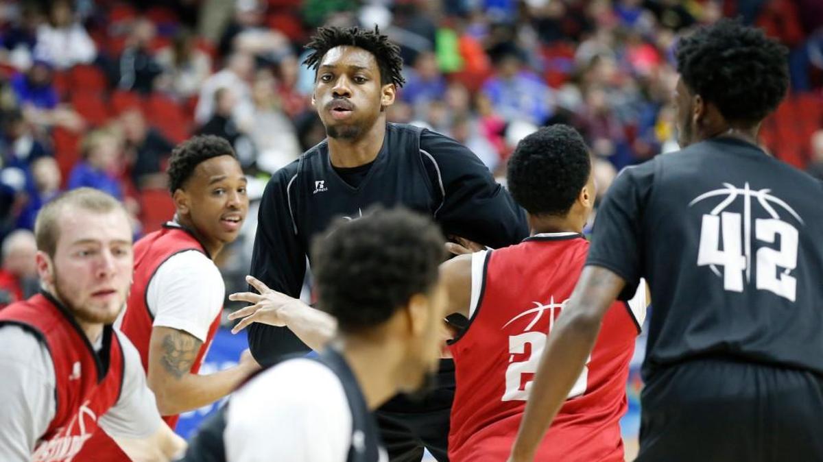 Chris Horton, top, towers over his Austin Peay teammates during a practice session Wednesday in Des Moines.