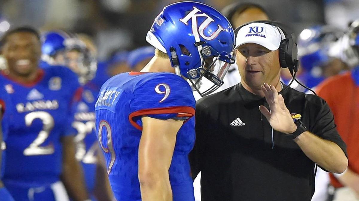 Kansas Jayhawks head coach David Beaty talked to Jayhawks quarterback Carter Stanley during a game in September.