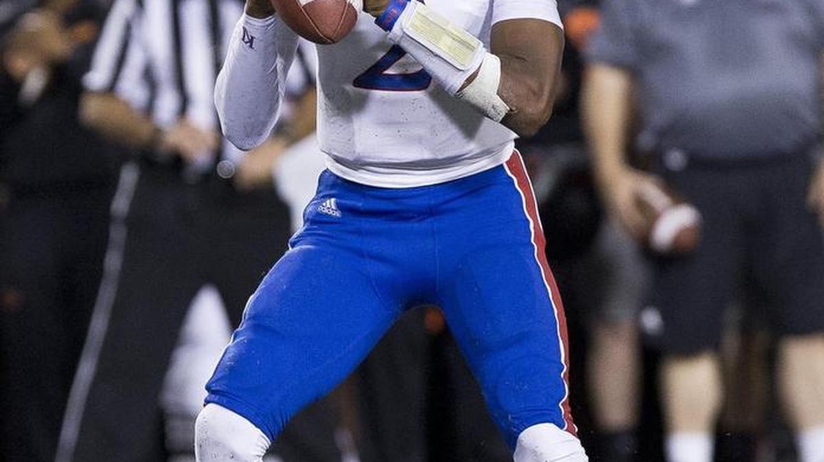 
Jayhawk quarterback Montell Cozart looks to pass against Oklahoma State last season.
