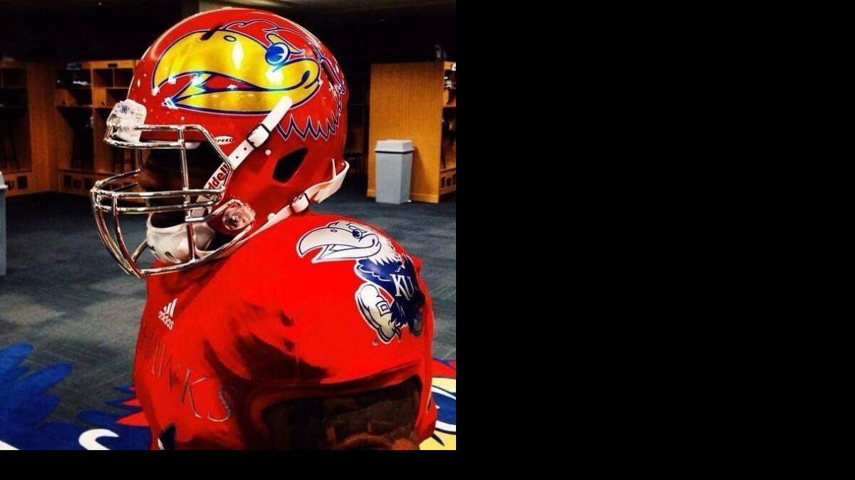 
Kansas’ new red uniform and helmet for 2014.

