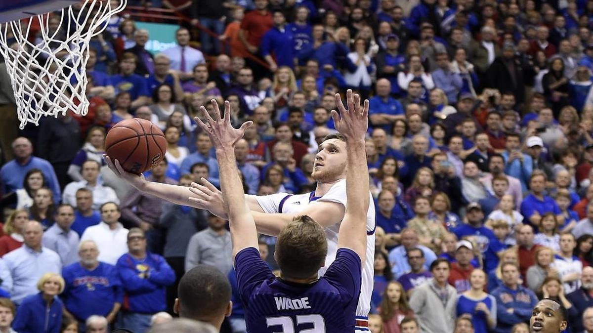KU’s Svi Mykhailiuk shoots over K-State’s Dean Wade in the first meeting between the teams this season at Allen Fieldhouse.