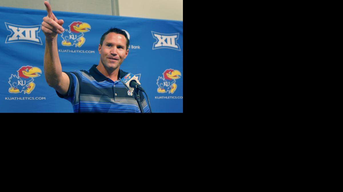 
Kansas interim football coach Clint Bowen pointed to his wife while answering a question his news conference in Lawrence on Monday. Bowen replaces Charlie Weis, who was fired after Saturday’s 23-0 loss to Texas.
