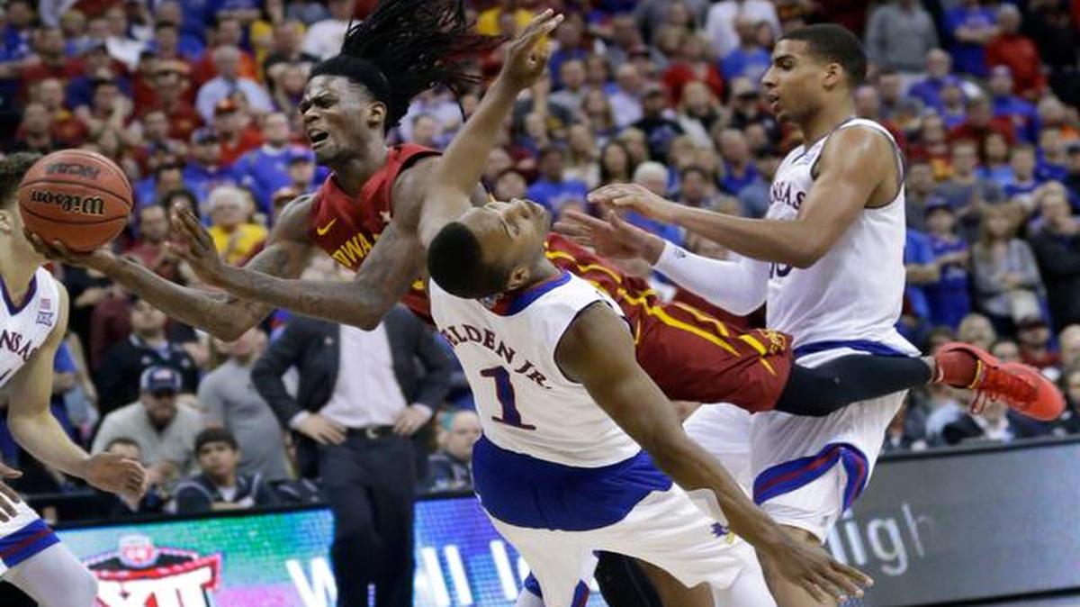 
Iowa State forward Jameel McKay collides with Kansas guard Wayne Selden during the second half of the Big 12 final Saturday in Kansas City, Mo.
