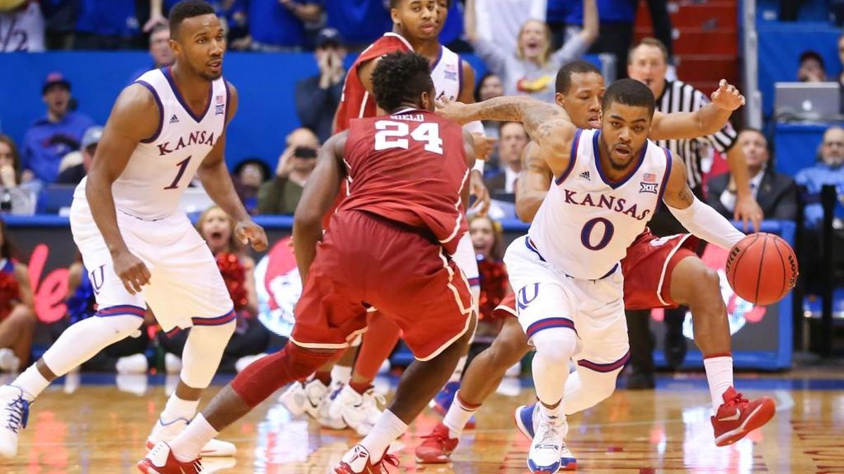 Frank Mason steals the ball on an inbounds pass, eventually putting KU ahead by three points late in the third overtime Monday.