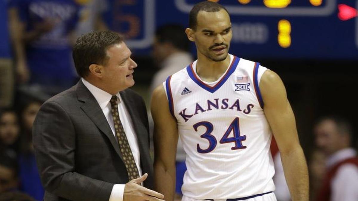 Kansas’ Bill Self, left, and senior Perry Ellis.