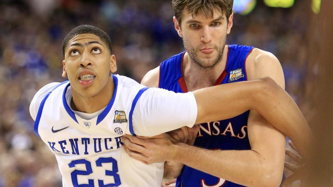 KU’s Jeff Withey, right, battles for rebound position against Anthony Davis in the 2012 NCAA championship game. Withey and former KU forward Dedric Lawson will play in South Korea this season.