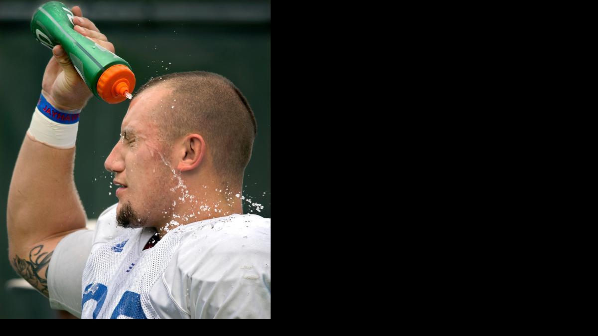 
Kansas defensive lineman T.J. Semke works part-time as a bounty hunter. He cooled off during practice on Friday.
