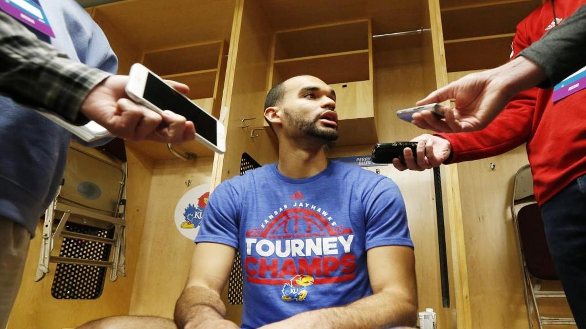 Kansas forward Perry Ellis talks with reporters before Kansas' first practice session Wednesday.
