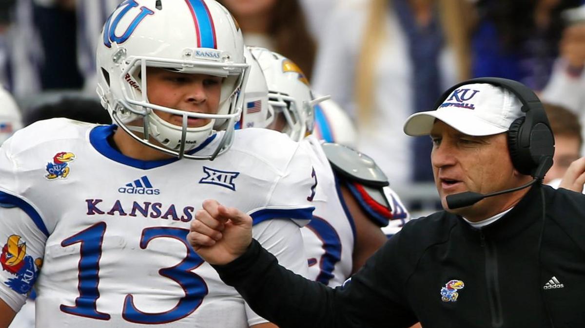 Kansas quarterback Ryan Willis and coach David Beaty on the sideline in the first half Saturday in Fort Worth.