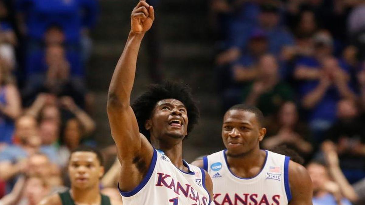 Kansas guard Josh Jackson celebrates a basket with teammate Dwight Coleby in the second half Sunday in Tulsa.
