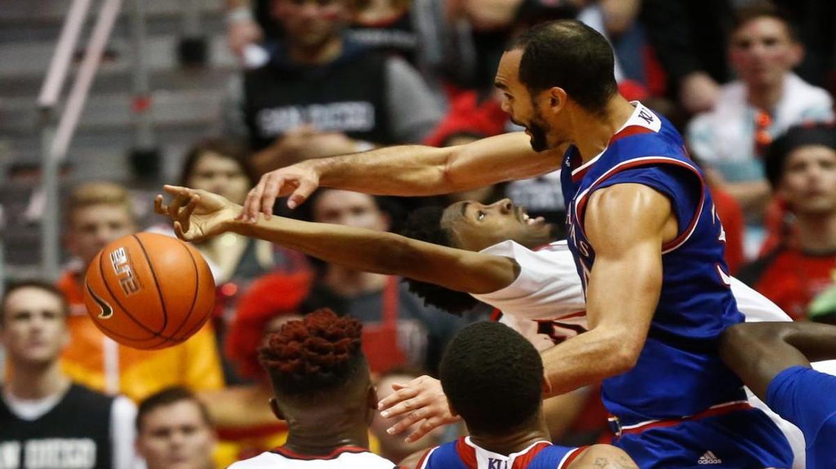 Kansas forward Perry Ellis blocks a shot by San Diego State guard Jeremy Hemsley during the first half Tuesday night in San Diego.