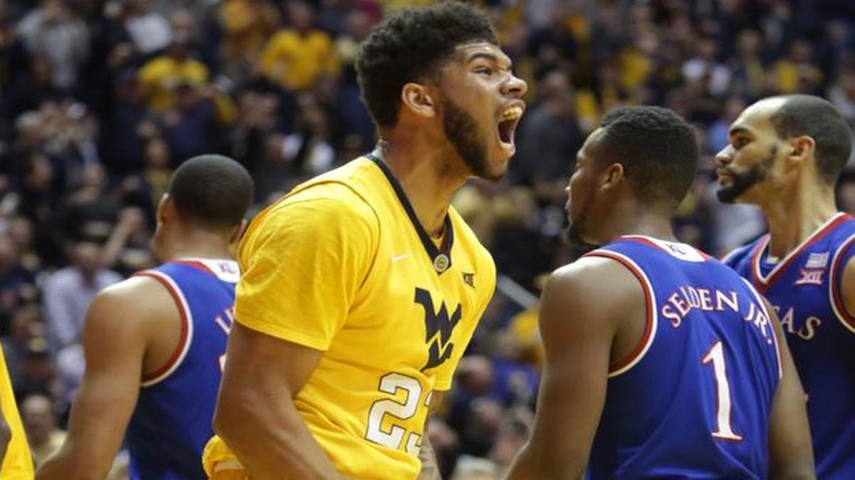 West Virginia’s Esa Ahmad reacts after scoring against Kansas last season.