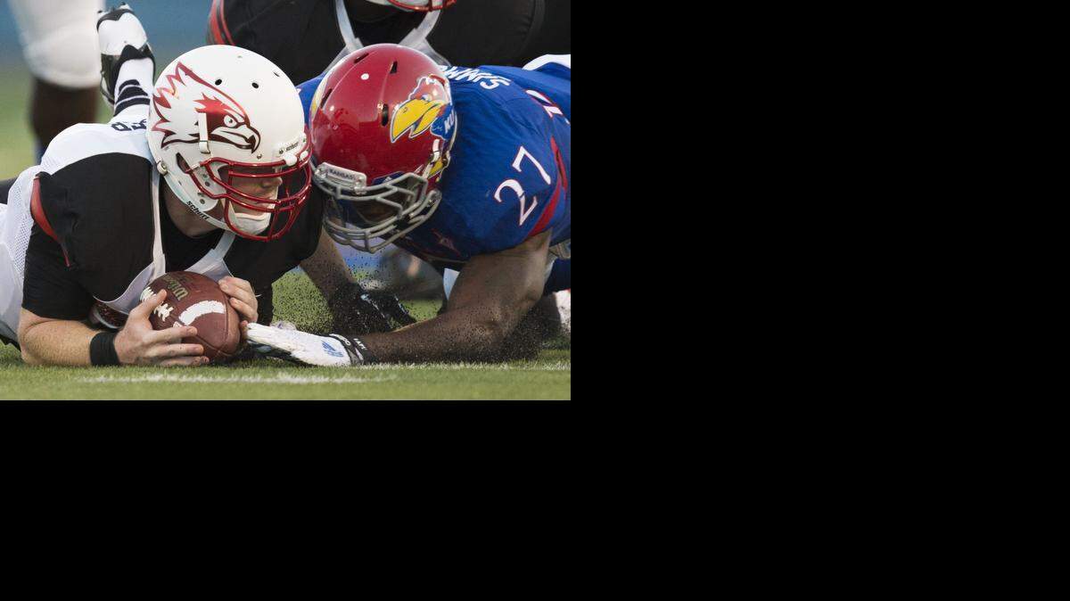 
Southeast Missouri State quarterback Kyle Snyder (left) and the Jayhawks’ Victor Simmons dived for a loose ball during their game in September.
