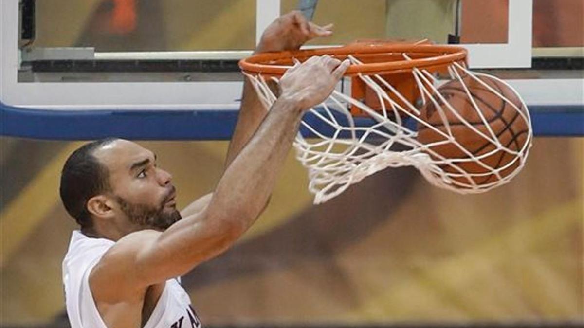 Kansas forward Perry Ellis dunks against Vanderbilt during the second half of an NCAA college basketball game in the Maui Invitational on Wednesday, Nov. 25, 2015, in Lahaina, Hawaii. Kansas defeated Vanderbilt 70-63.
