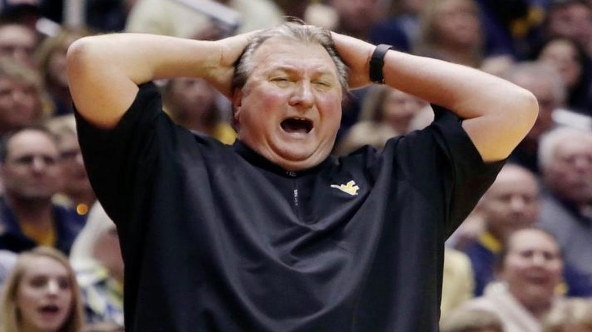 West Virginia coach Bob Huggins reacts to a call during Saturday game against Kansas State in Morgantown, W.Va. The Mountaineers play at Kansas on Monday night.