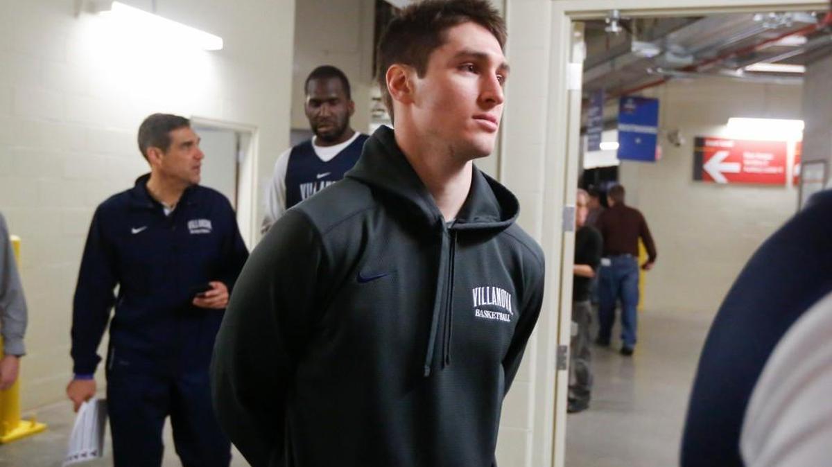 Villanova's Ryan Arcidiacono heads to a media interview room in the KFC Yum Center on Friday.