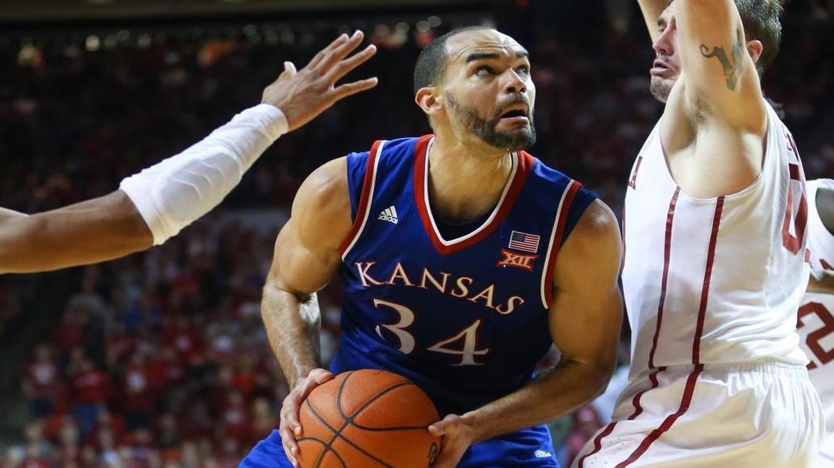 Kansas forward Perry Ellis looks to the basket against Oklahoma forward Ryan Spangler earlier this season.