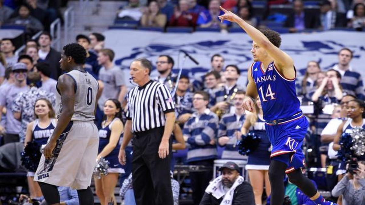 
Kansas' Brannen Greene points after he hit a three-point shot against Georgetown during the second half Wednesday in Washington. Greene made a career-high five three-point shots and Kansas won 75-70. 
