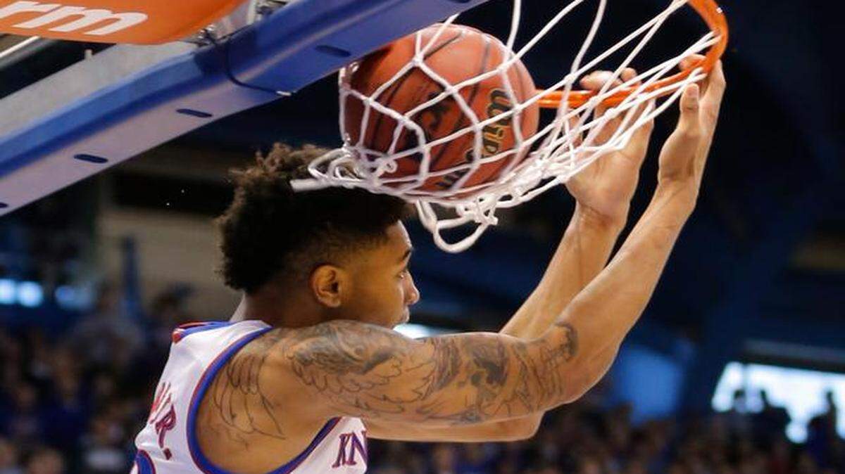 
Kansas guard Kelly Oubre Jr. makes a reverse dunk during the second half against Texas Tech on Saturday at Allen Fieldhouse.
