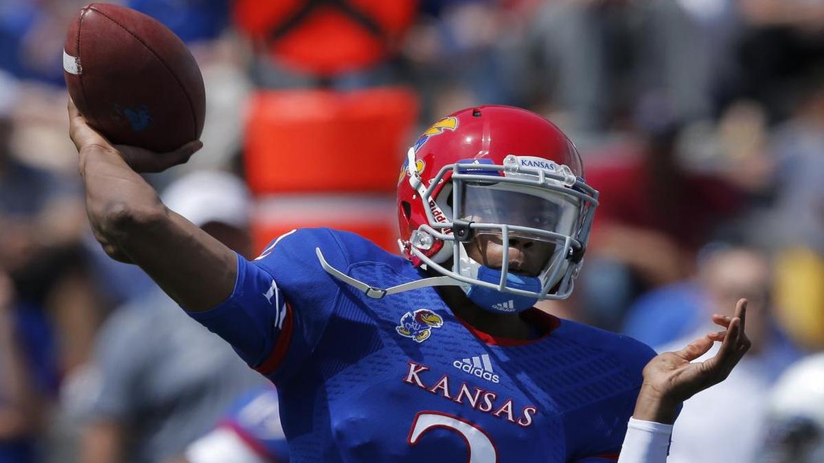 
Kansas quarterback Montell Cozart passes to a receiver during the first half of the spring game in April. Cozart will lead KU’s spread offense this season.
