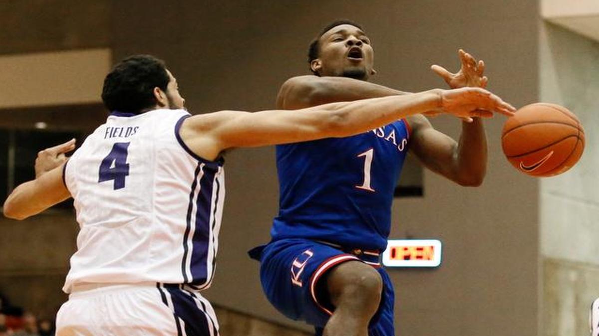 
TCU forward Amric Fields strips the ball from Kansas guard Wayne Selden Jr. on a drive to the basket.
