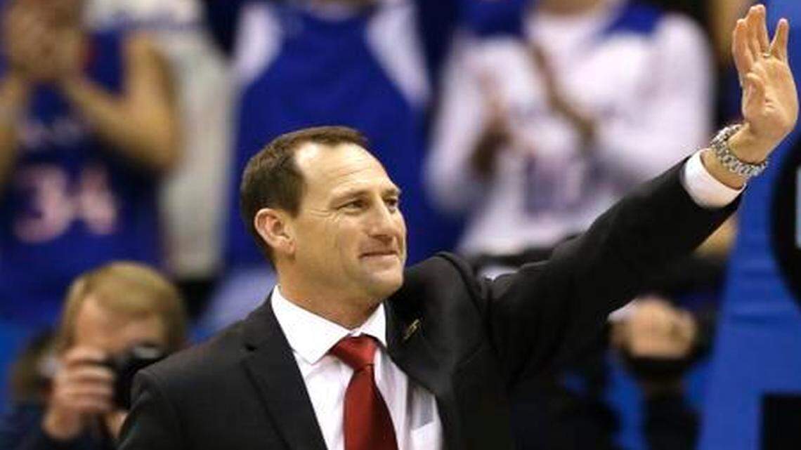 
Kansas football coach David Beaty waves to the crowd after being introduced during halftime of the Florida game Dec. 5.
