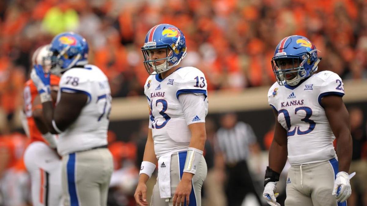 Ryan Willis (13) went into fall camp competing with Montell Cozart for KU’s starting quarterback job.