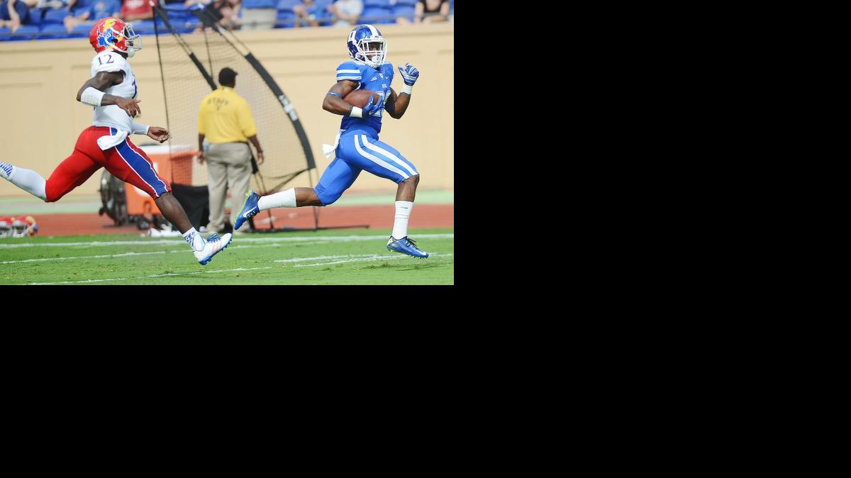 
Duke's Shaun Wilson runs away from Kansas’ Darious Crawley and scores a touchdown during the first half Saturday in Durham, N.C. 
