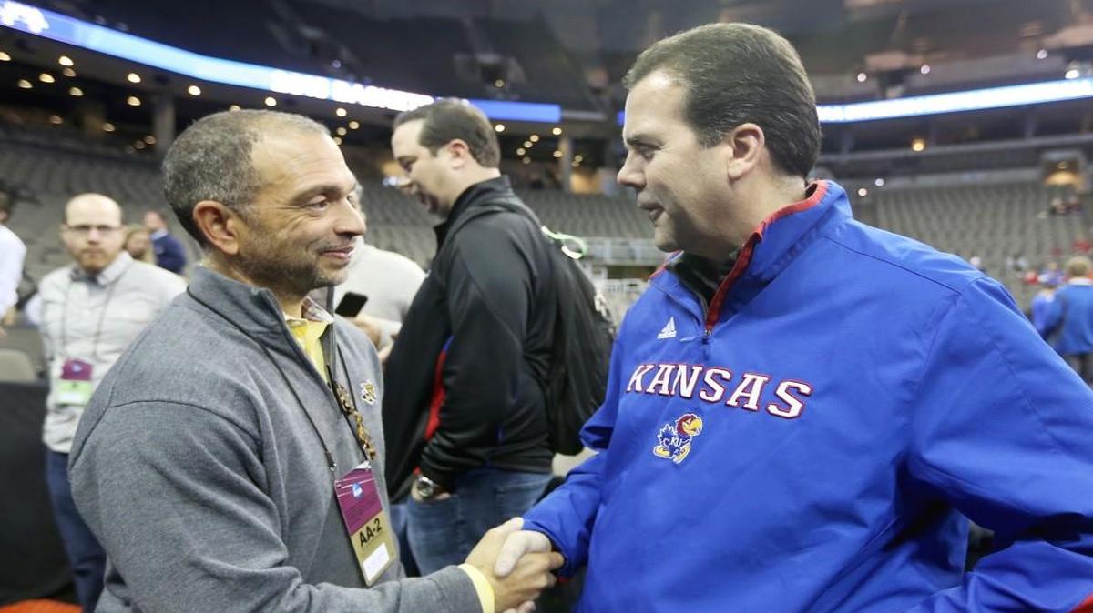 Kansas athletic director Sheahon Zenger shake hands with then-Wichita State AD Eric Sexton at the NCAA Tournament in Omaha in March 2015.