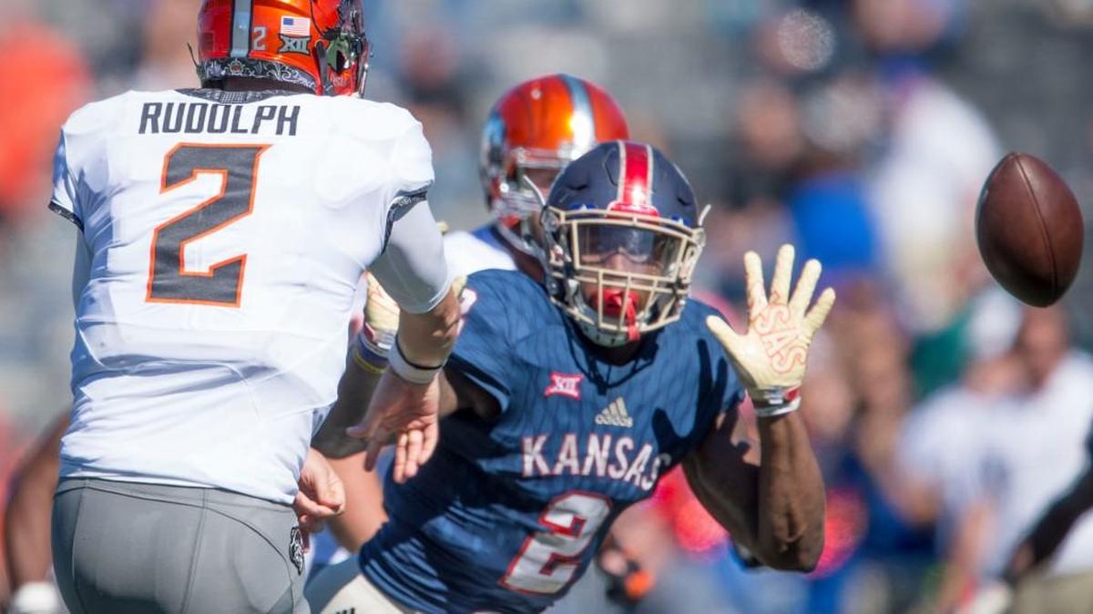 KU’s Dorance Armstrong pressures Oklahoma State quarterback Mason Rudolph during their Oct. 22 game in Lawrence.